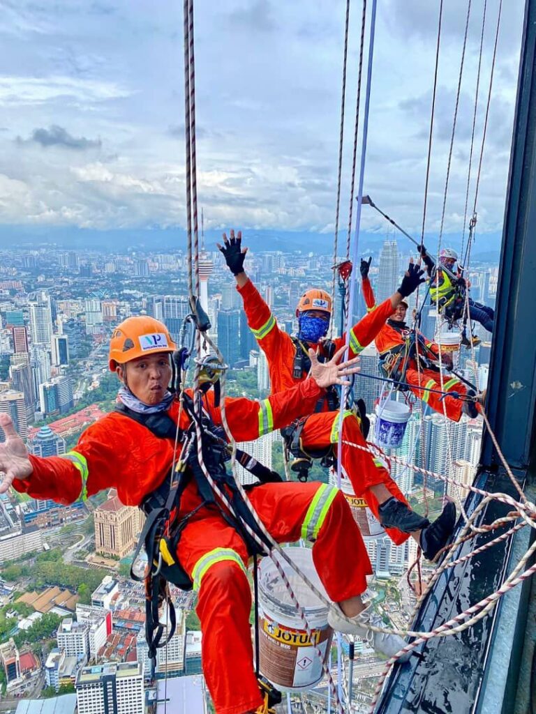 Vertical Pro rope-access technicians working on a facade